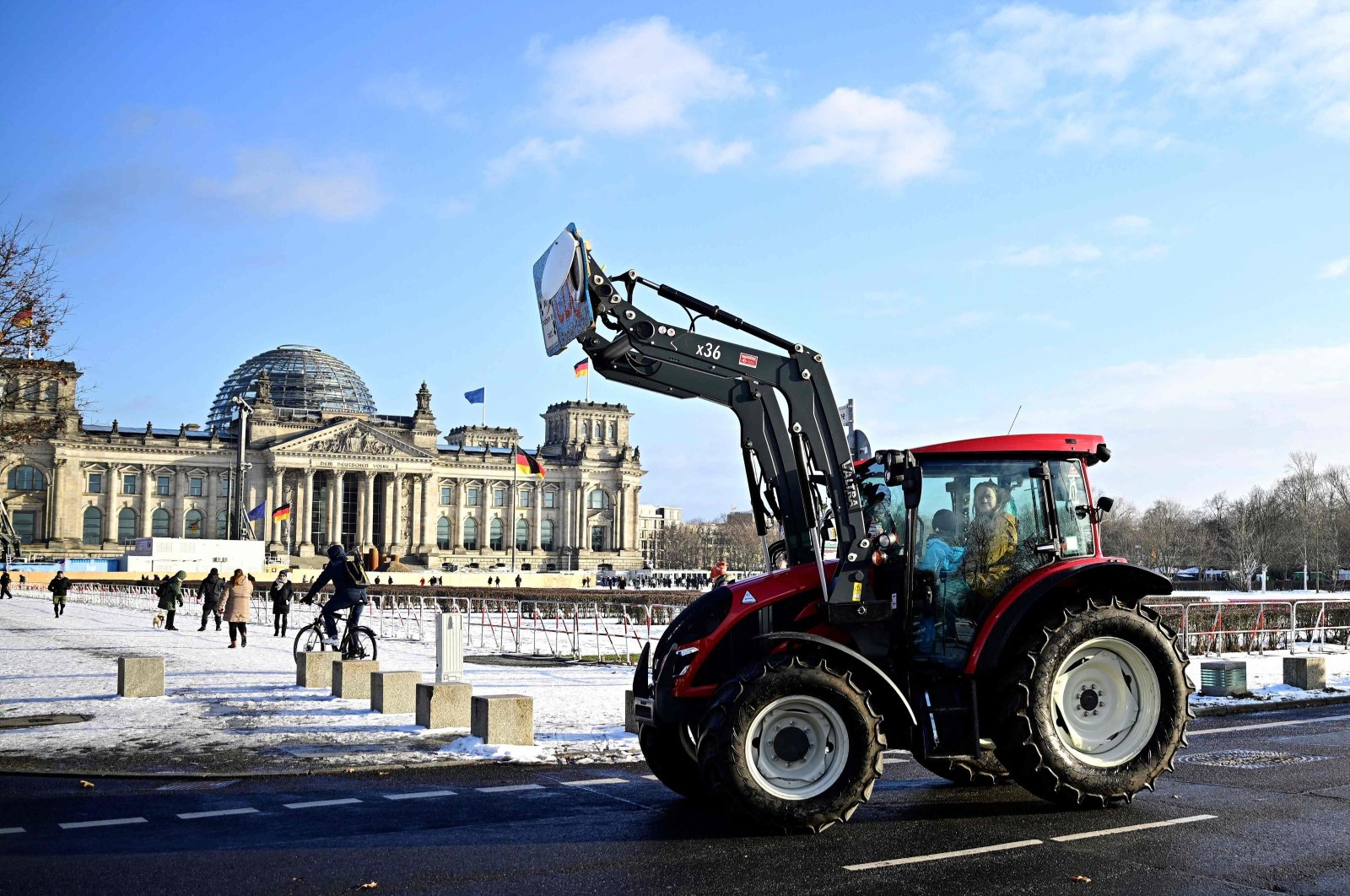 Farmers drive their tractors near the Reichstag building during a protest under the title &quot;We are fed up with agricultural industry&quot; against industrial food production, Berlin, Germany, Jan. 20, 2024. (AFP Photo)
