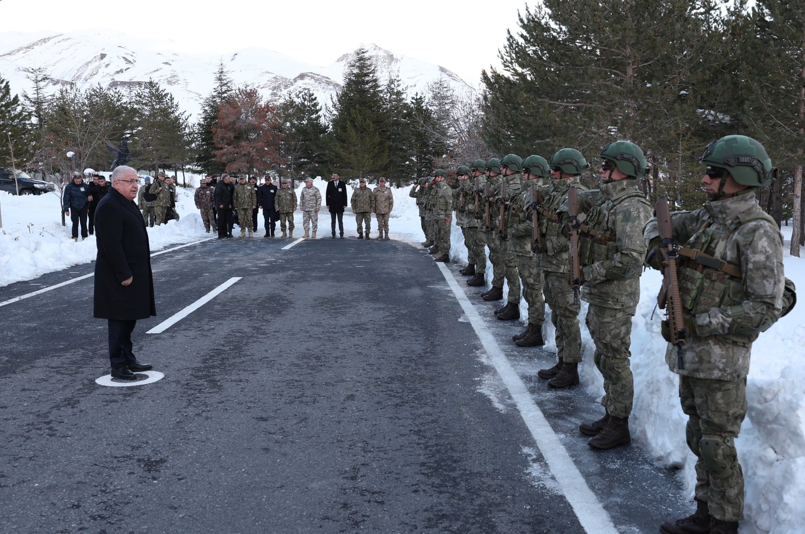 Defense Minister Yaşar Güler (L) greets commandos taking part in operations against the PKK terrorist group, Hakkari, southeastern Türkiye, Dec. 25, 2023. (AA Photo)