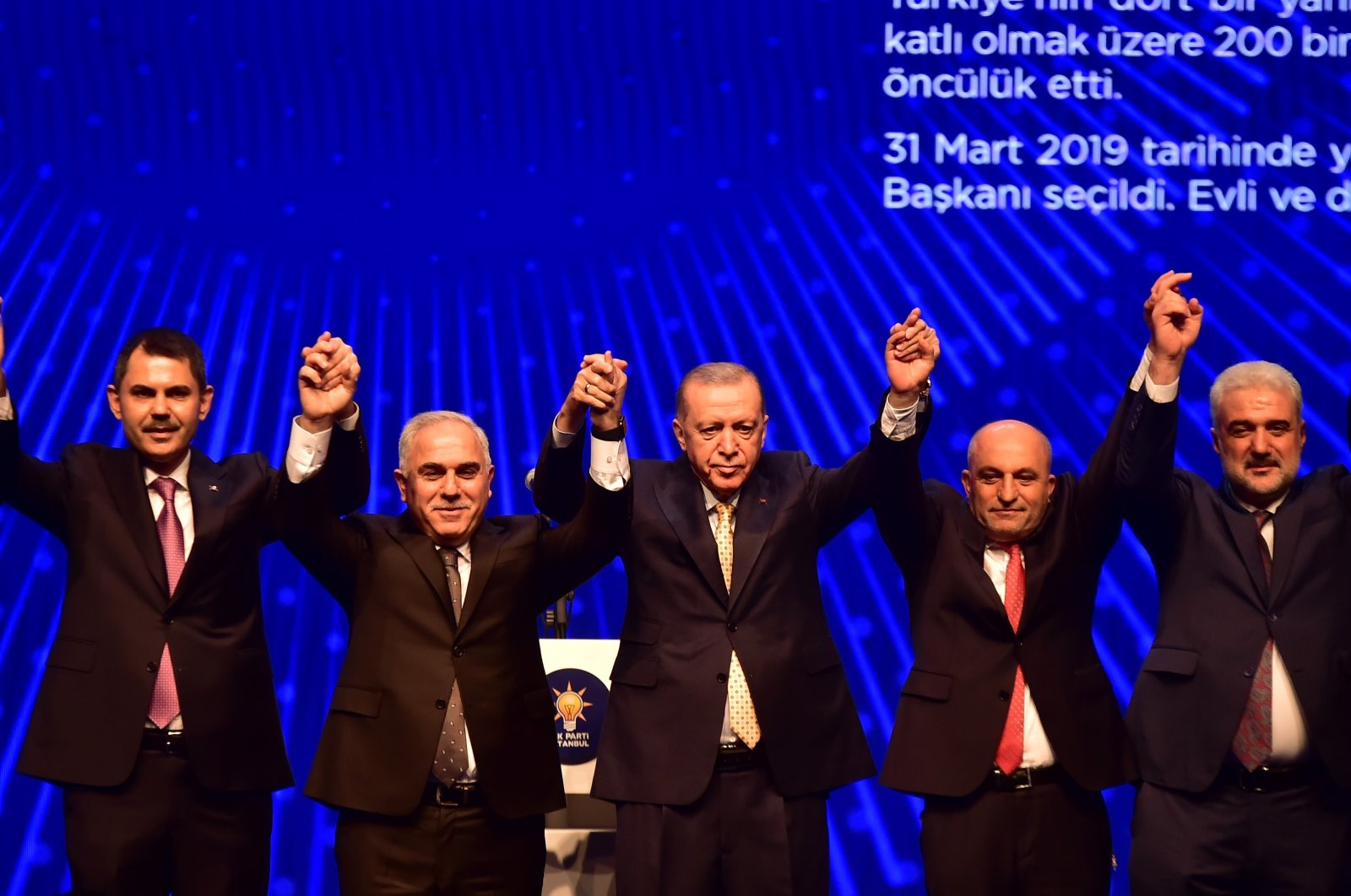 President Recep Tayyip Erdoğan (C) poses with Istanbul district candidates of the Justice and Development Party (AK Party) at an event, Istanbul, Türkiye, Jan. 20, 2024. (İHA Photo)