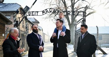 This handout picture released by the European Jewish Association shows X (formerly Twitter) CEO Elon Musk with his son (2R), EJA Chairman Rabbi Menachem Margolin (2L), Holocaust survivor Gidon Lev (L) and Conservative political commentator, writer and lawyer Ben Shapiro at the Memorial and Museum Auschwitz-Birkenau former German Nazi concentration and extermination camp during an EJA (European Jewish Association) Delegation to Auschwitz in Oswiecim, Poland on Jan. 22, 2024. (European Jewish Association via AFP)