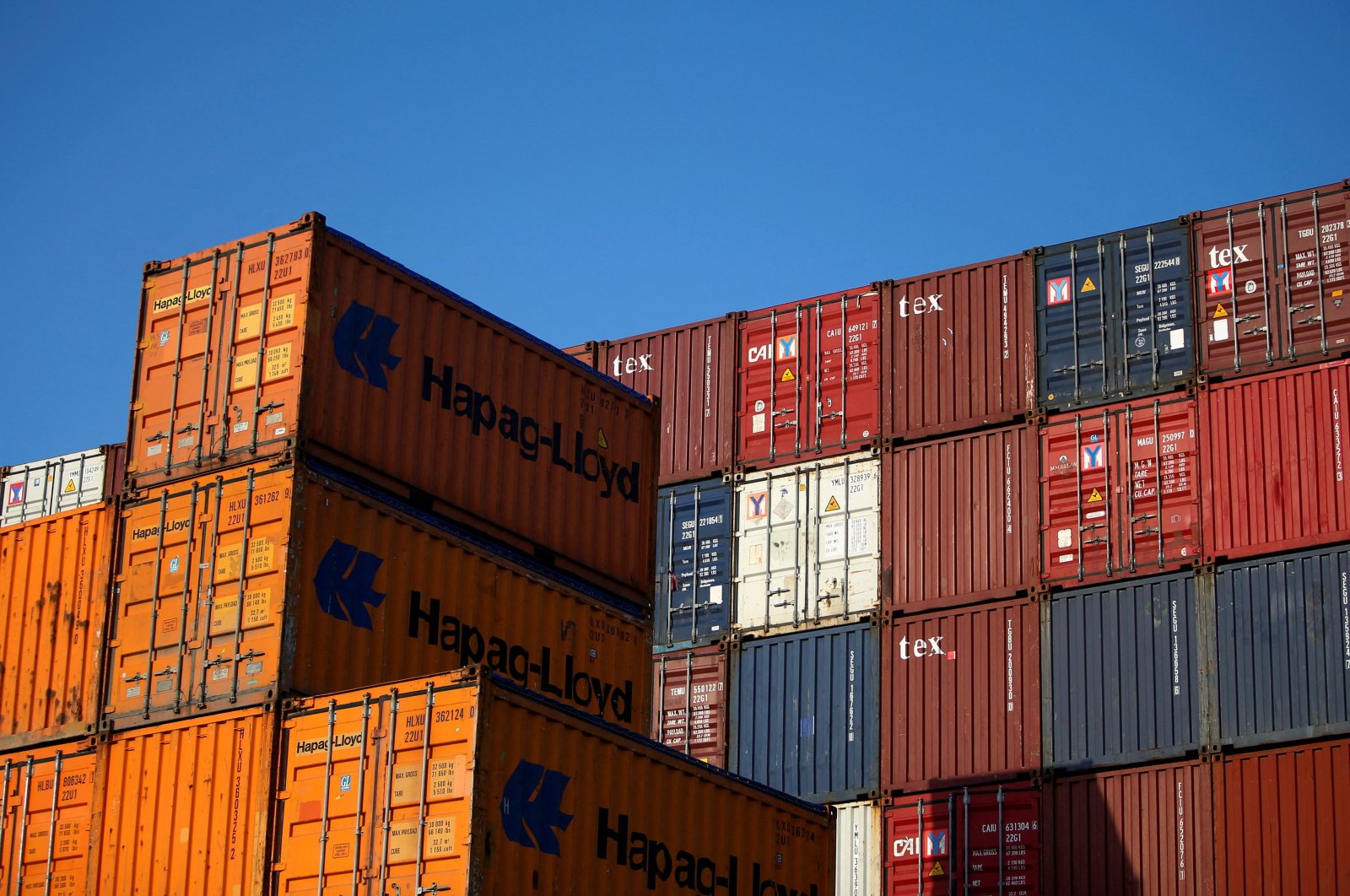 Piled up containers at the harbor in Hamburg, Germany, July 19, 2022. (Reuters Photo)