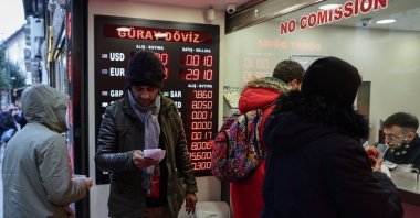 People visit a currency exchange office, Istanbul, Türkiye, Jan. 11, 2024. (EPA Photo)