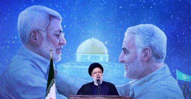 Iranian President Ebrahim Raisi speaks during a commemoration ceremony marking the anniversary of the 2020 killing of Guards General Qasem Soleimani (on screen-R) and Iraqi commander Abu Mahdi al-Muhandis (on screen-L) in the capital Tehran, Iran, Jan. 3, 2024. (AFP Photo)