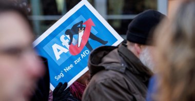 A person holds up a placard reading &quot;Say Nope to AFD&quot; as she takes part in a demonstration against racism and far-right politics, in Erfurt, eastern Germany on Jan. 20, 2024. (AFP Photo)
