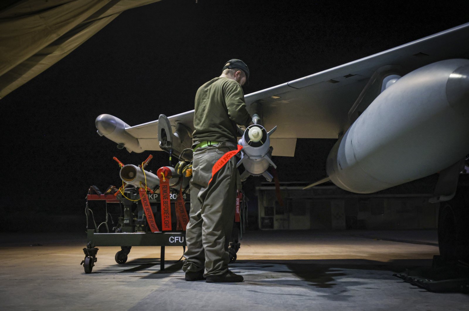 RAF Armourers (Weapon Technicians) prepare a Royal Air Force Typhoon FGR4 for airstrikes against Houthi military targets in Yemen, Jan. 21, 2024. (AP Photo)