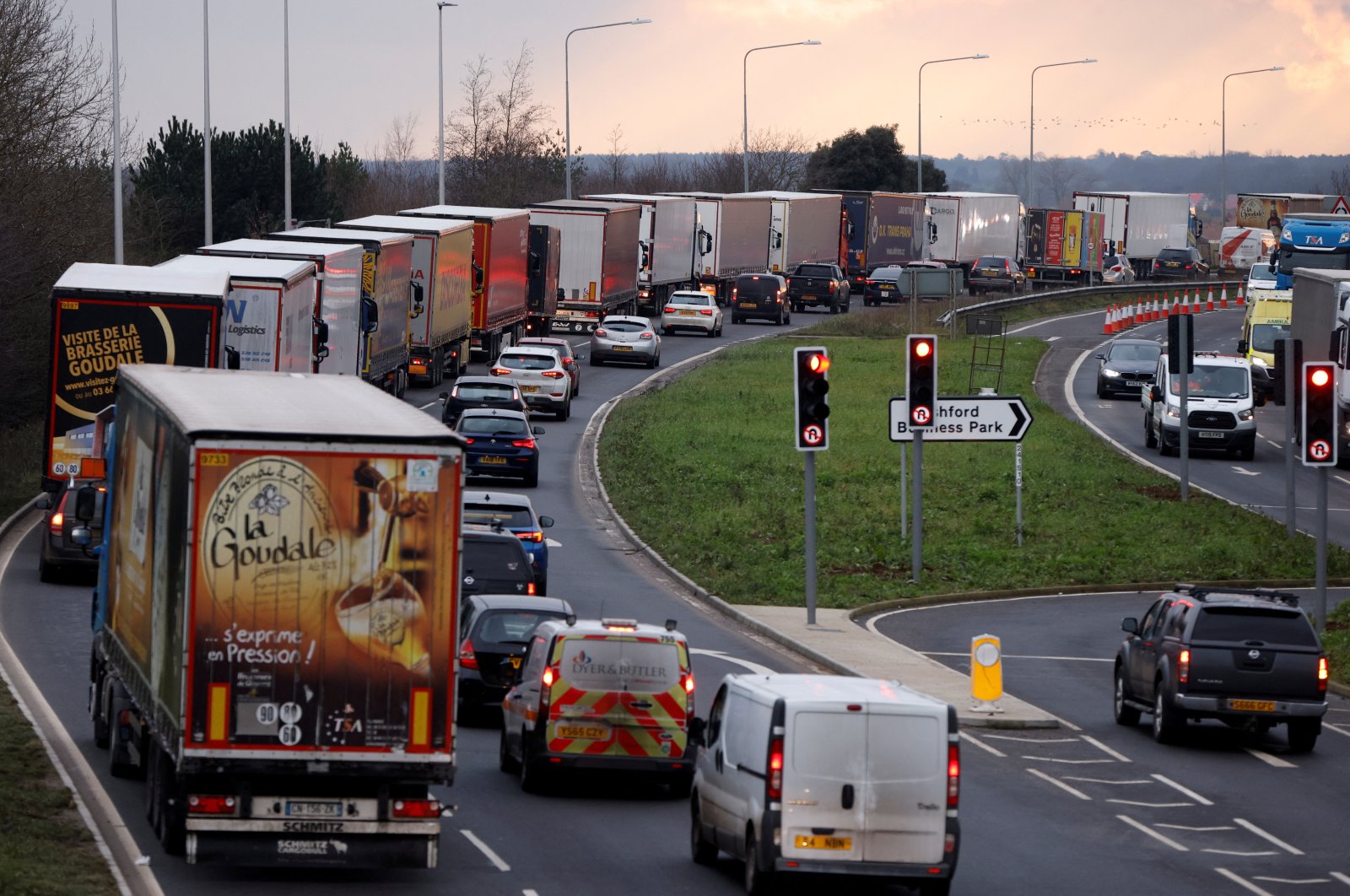 Trucks line up on the road leading to the Waterbrook Inland Border Facility, a temporary customs clearance center set up in a truck stop in Ashford, Kent, Britain, Jan. 15, 2021. (Reuters Photo)