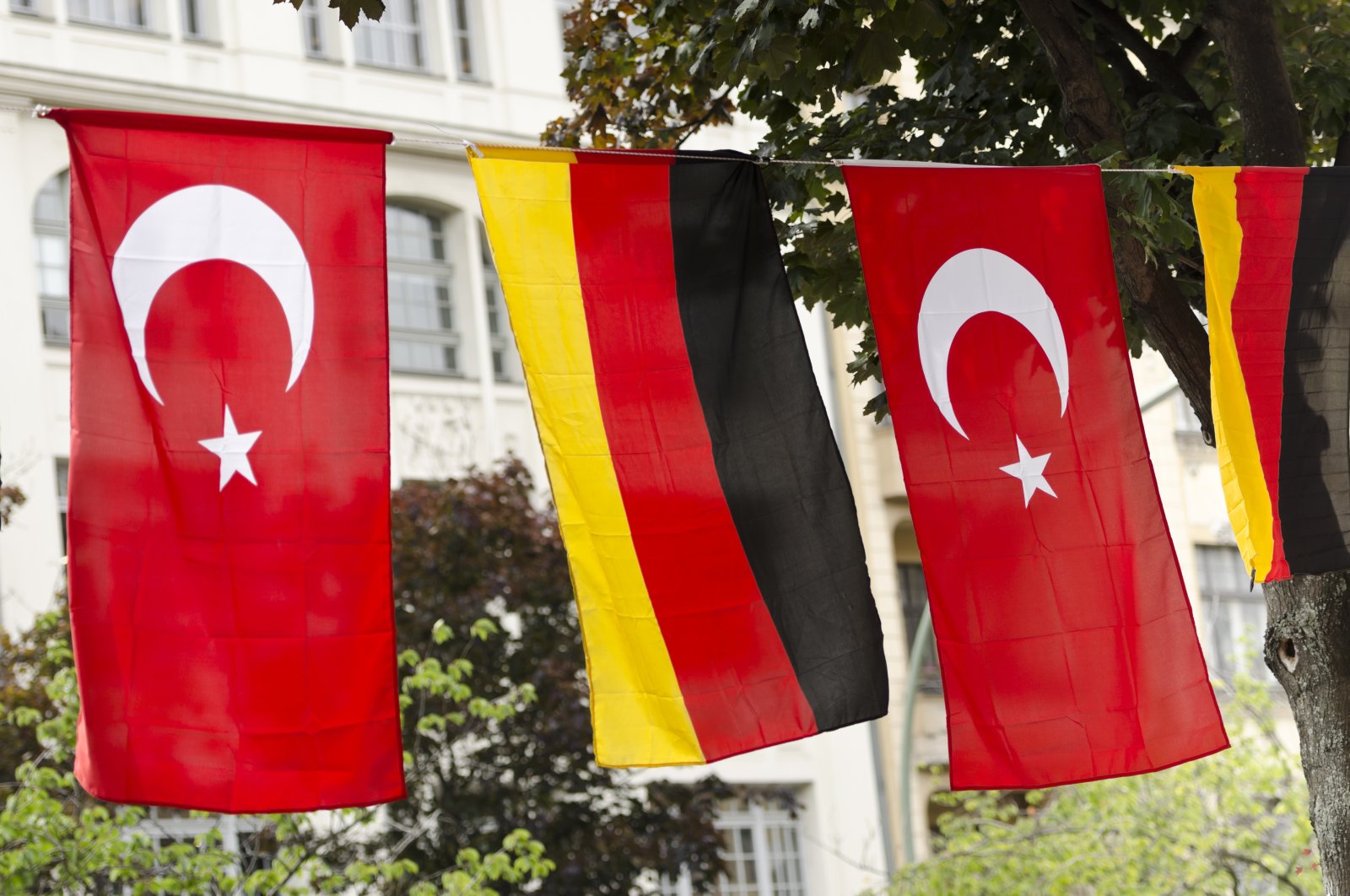 The flags of Germany and Türkiye hanging outside on a street in Kreuzberg, Berlin, Germany. (Getty Images)
