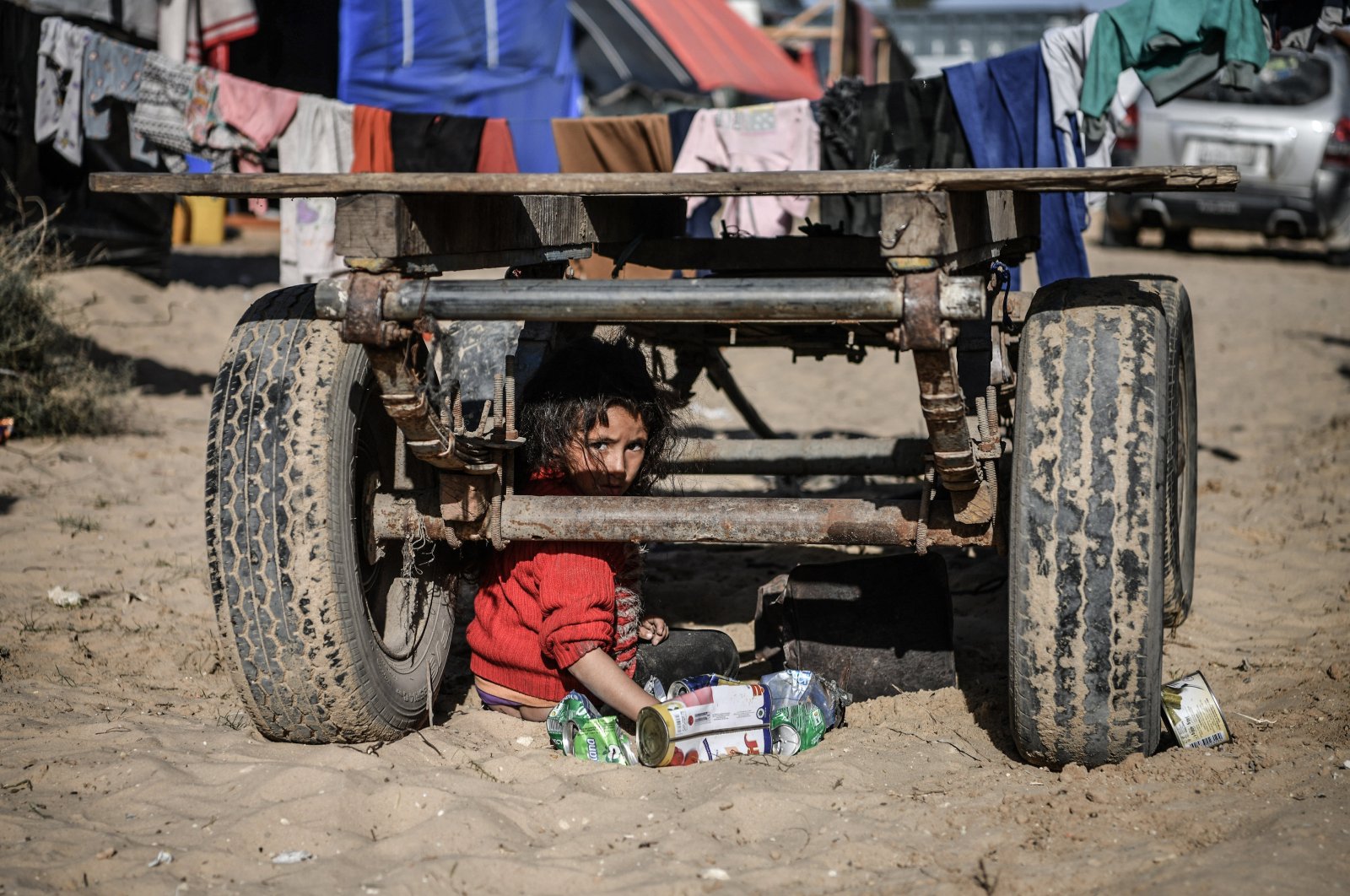 A Palestinian child plays outside at a refugee camp in Rafah, Gaza, Palestine, Jan. 22, 2024. (AA Photo)