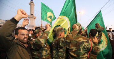 Members of Iraqi Shiite Popular Mobilization Forces (PMF) chant anti-U.S. slogans in Baghdad, Iraq, Jan. 4, 2024. (EPA Photo)