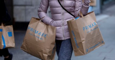 A woman carries Primark shopping bags on Oxford Street, in London, Britain, Jan. 16, 2023. (Reuters Photo)