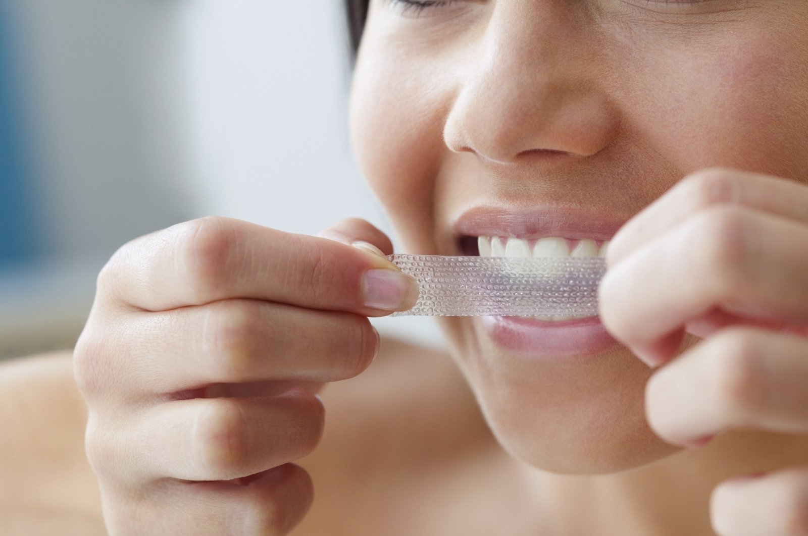 Whiting strips are a temporary way of whitening teeth. (Getty Images Photo)