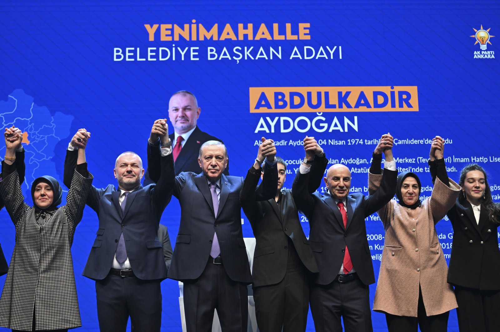 President Recep Tayyip Erdoğan (3rd-L) greets the crowd with district mayor candidates for the upcoming local elections at a ceremony in the capital Ankara, Türkiye, Jan. 24, 2024. (AA Photo)