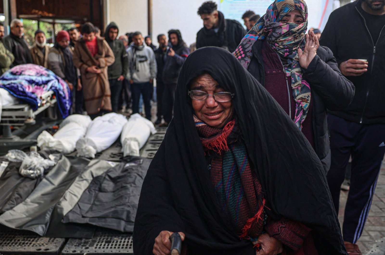 Palestinians wait at a hospital to collect the bodies of their relatives killed in Israeli bombardment, Rafah, southern Gaza Strip, Palestine, Jan. 24, 2024. (AFP Photo)