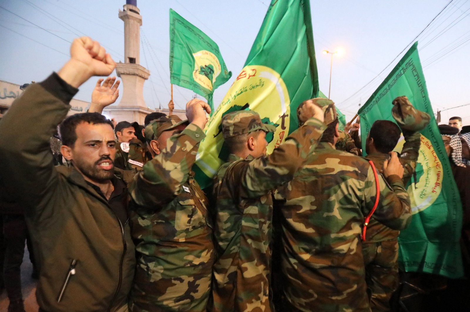 Members of Iraqi Shiite Popular Mobilization Forces (PMF) chant anti-U.S. slogans in Baghdad, Iraq, Jan. 4, 2024. (EPA Photo)