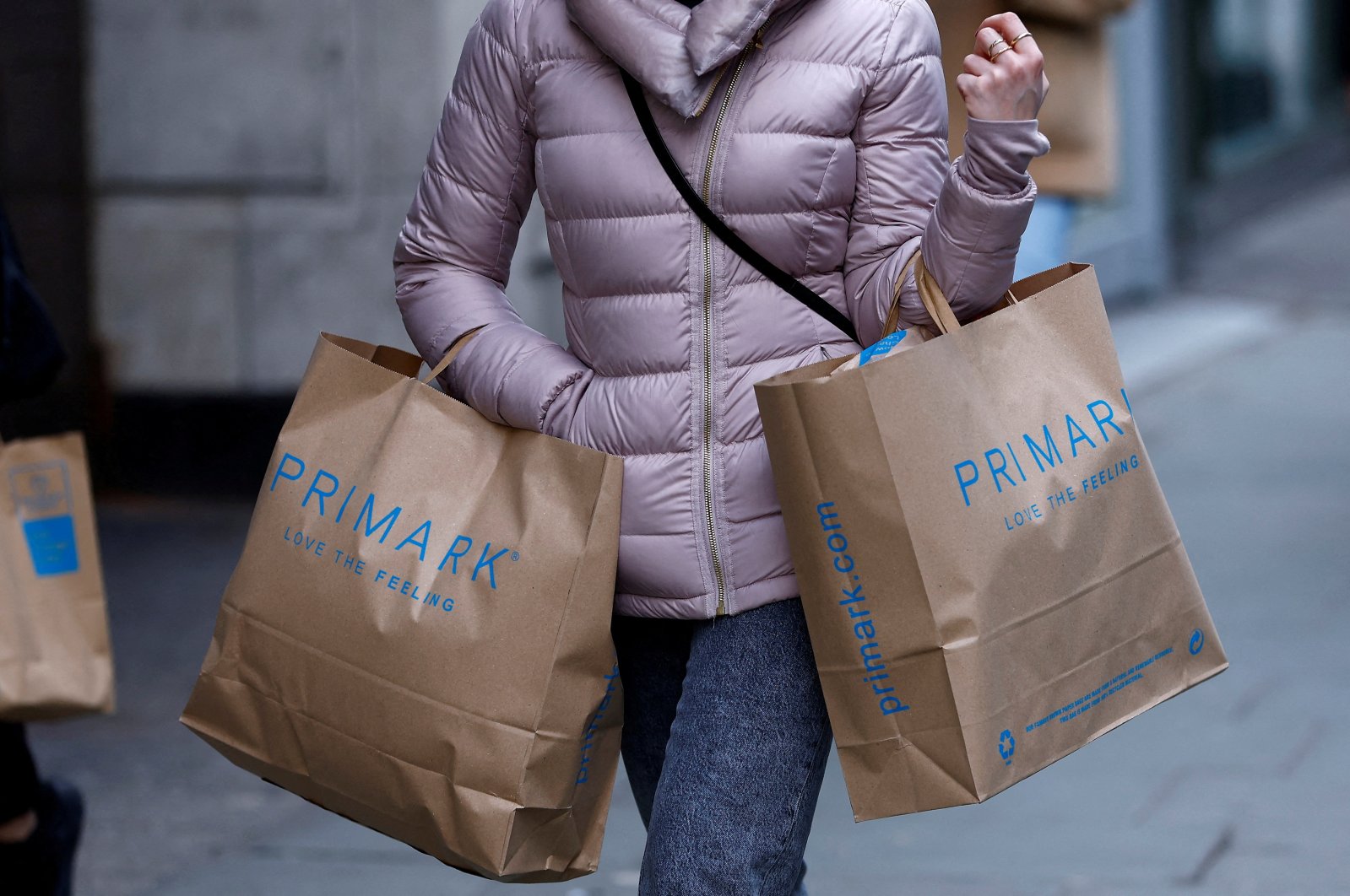 A woman carries Primark shopping bags on Oxford Street, in London, Britain, Jan. 16, 2023. (Reuters Photo)