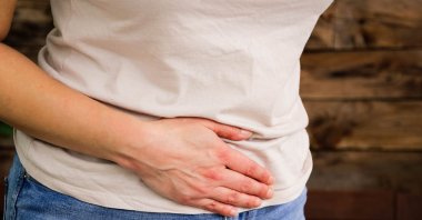 Menopause symptoms can be physically and mentally exhausting for women. Swimming in cold water is considered one solution to help alleviate these symptoms. (Getty Images Photo) 