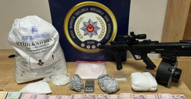Police display drugs, cash, arms and other smuggled material seized during anti-narcotics operations across 41 provinces, Türkiye, Jan. 25, 2024. (DHA Photo)