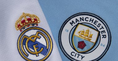 Real Madrid (L) and Manchester City club crests on their first team home shirts, Manchester, U.K., Sept. 1, 2020. (Getty Images Photo)