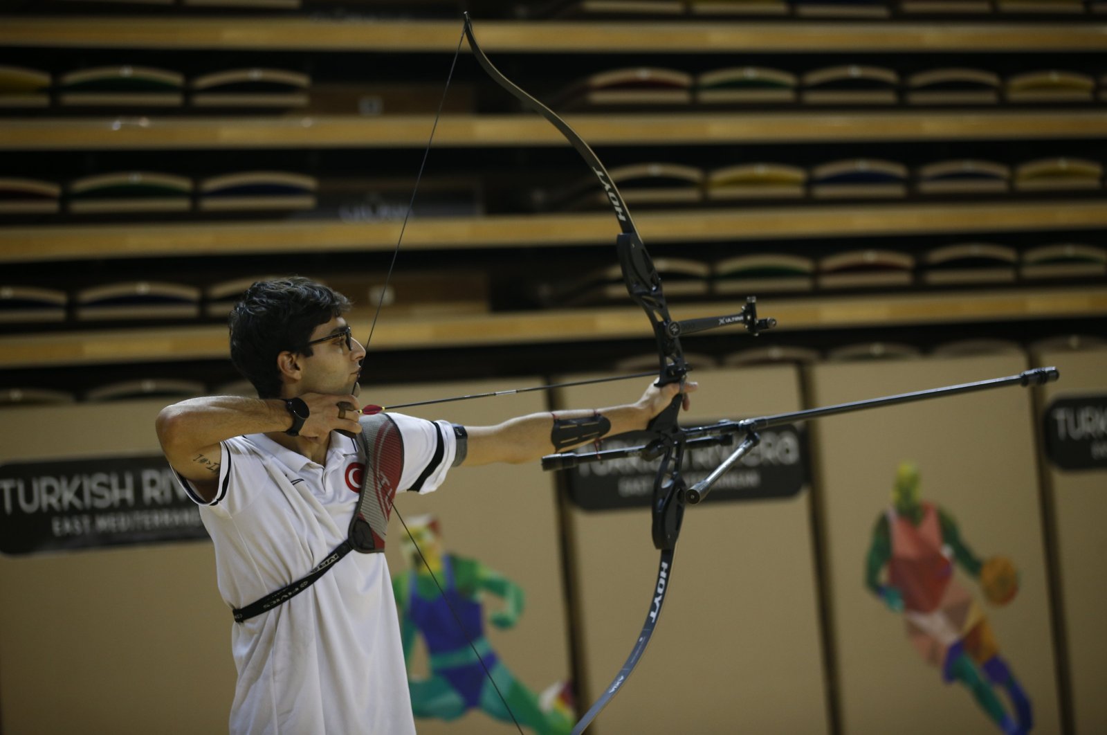 Turkish archer Ulaş Berkim Tümer shoots an arrow during his training, Istanbul, Türkiye, Jan. 25, 2024. (AA Photo)