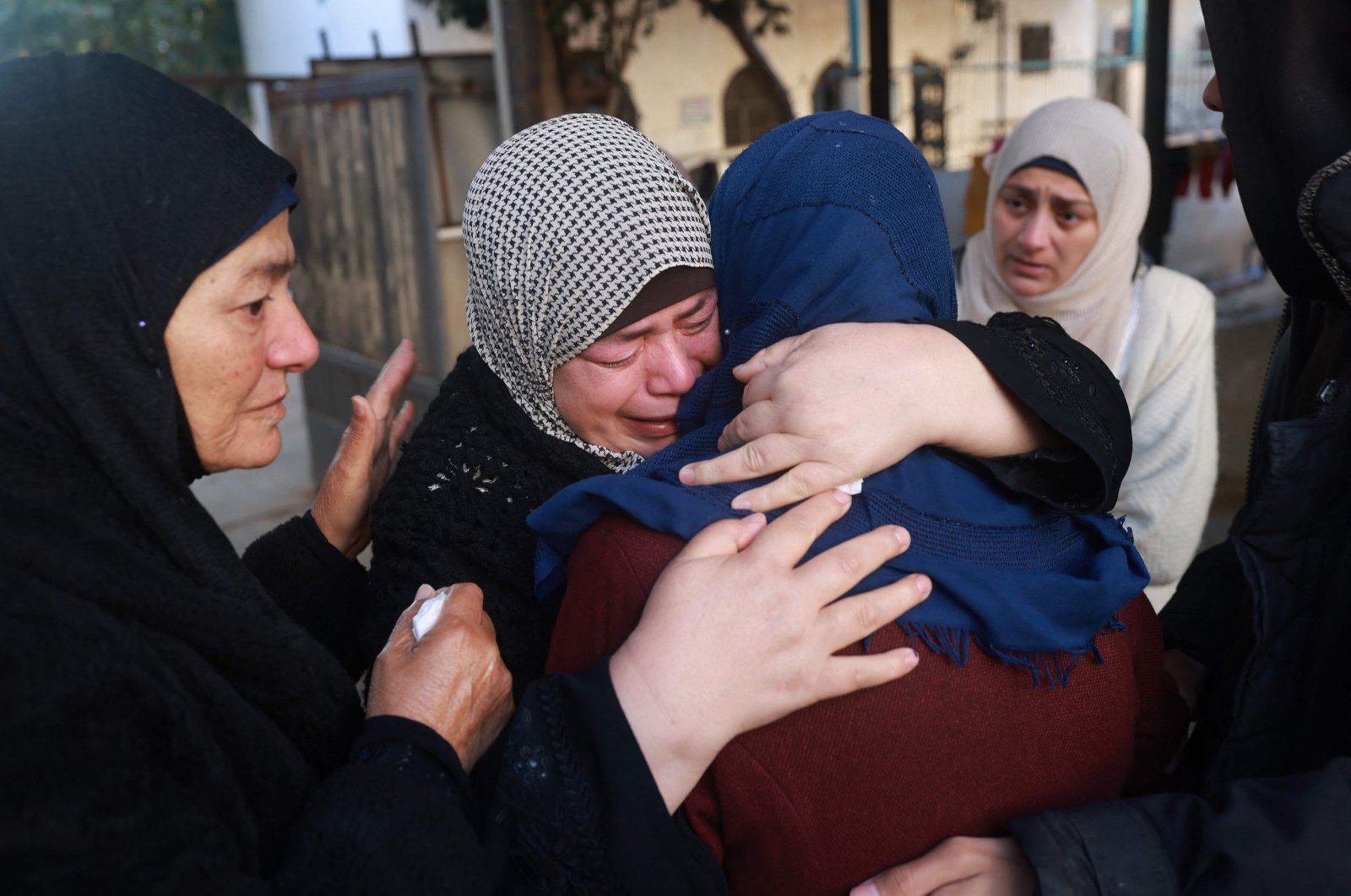 Palestinian women mourn their loved ones outside the Najjar hospital in Rafah, Palestine, Jan. 25, 2024. (AFP Photo)