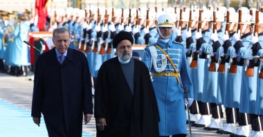 President Recep Tayyip Erdoğan (R) and Iranian President Ebrahim Raisi (C) inspect a guard of honor during a welcoming ceremony in Ankara, Türkiye, Jan. 24, 2024. (AFP Photo)