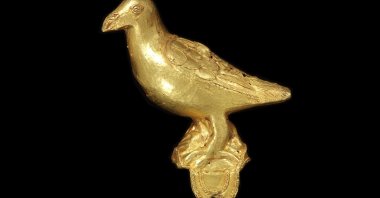 A cast gold ornament, in the form of a bird, probably from a ceremonial hat, originating from Ghana. (AP Photos) 