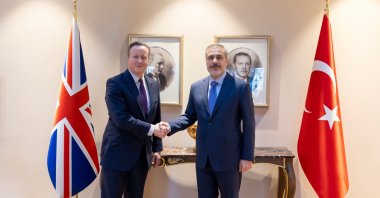 Foreign Minister Hakan Fidan (R) shakes hands with his counterpart UK Foreign Secretary David Cameron (L) during their meeting in Istanbul, Türkiye, on January 26, 2024. (AFP Photo) 