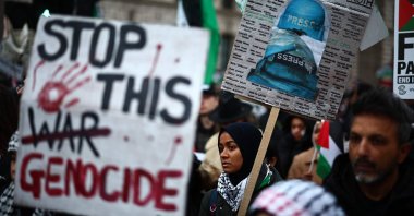 Pro-Palestinian activists and supporters carry placards, including a sign featuring names of killed and wounded journalists, London, U.K., Jan. 13, 2024. (AFP Photo)