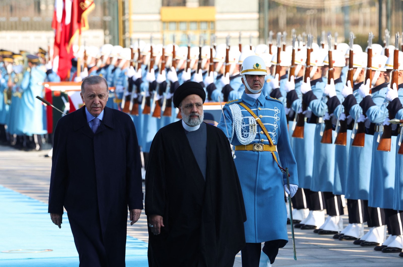 President Recep Tayyip Erdoğan (R) and Iranian President Ebrahim Raisi (C) inspect a guard of honor during a welcoming ceremony in Ankara, Türkiye, Jan. 24, 2024. (AFP Photo)