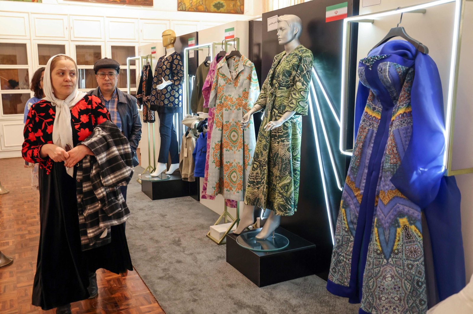 Visitors visit the exhibition on fashion and clothes designed by young Iranian designers, at Saadabad Palace, Tehran, Iran, Jan. 21, 2024. (AFP Photo)