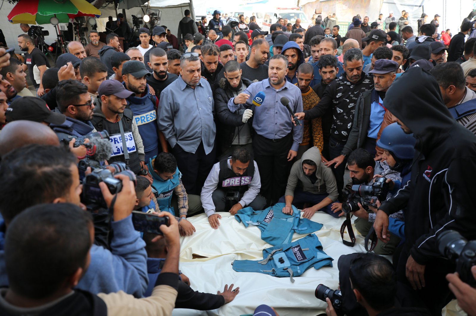 Journalists, relatives and friends pray over the bodies of journalists Sari Mansour and Hassouna Esleem after they were killed in an Israeli bombardment on the central Gaza Strip, Palestine, Nov. 19, 2023. (Reuters Photo)