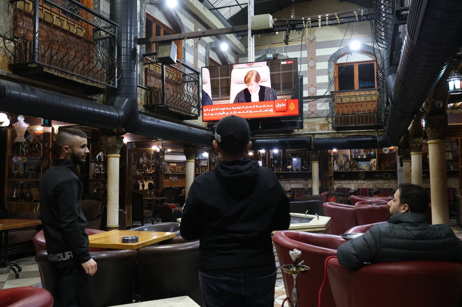 Palestinians watch a live stream from the ICJ in The Hague regarding South Africa&#039;s Gaza genocide case against Israel, Jenin, Palestine, Jan. 26, 2024. (EPA Photo)