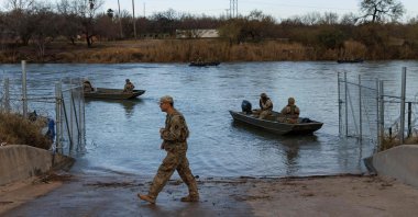 Texas National Guard soldiers patrol the Rio Grande near Shelby Park on Jan. 26, 2024. (AFP Photo)