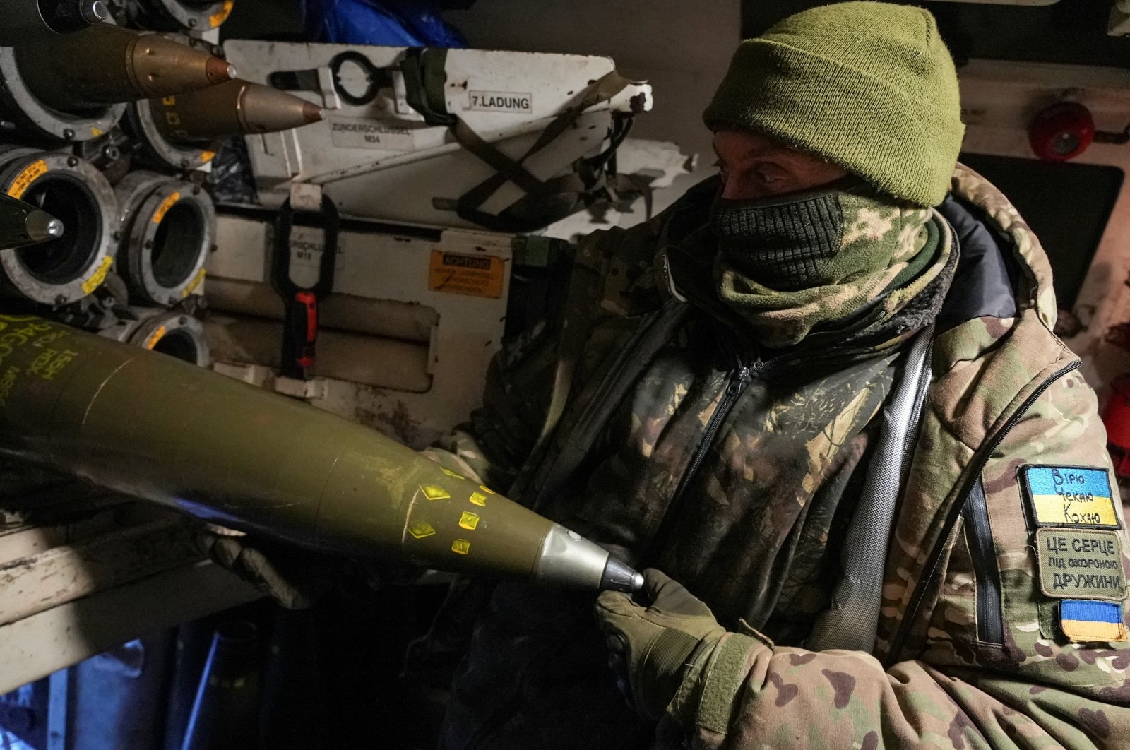 A Ukrainian serviceman shows 155-mm shells near Bakhmut, Ukraine, Jan. 16, 2024. (Reuters Photo)