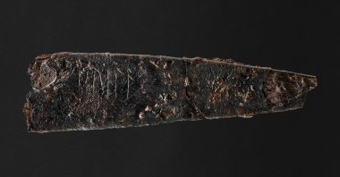 An undated handout photo from the Museum Odense in Denmark shows a small knife inscribed with runes dating back nearly 2,000 years, the oldest writing found in the country. (AFP Photo)