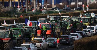 Farmers driving tractors take part in a road blockage of the A6 highway near Villabe, south of Paris, Jan. 29, 2024. (AFP Photo)