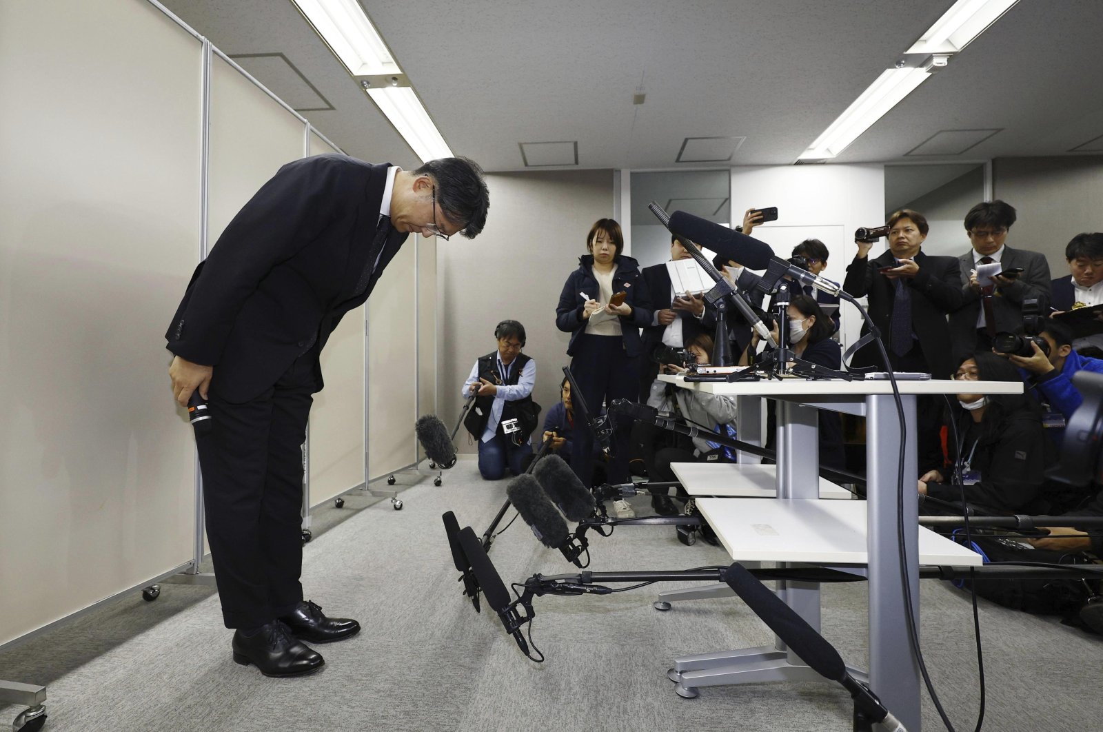 Toyota Motor Corp. CEO Koji Sato bows in front of the media in Tokyo, Japan, Jan. 29, 2024. (AP Photo)
