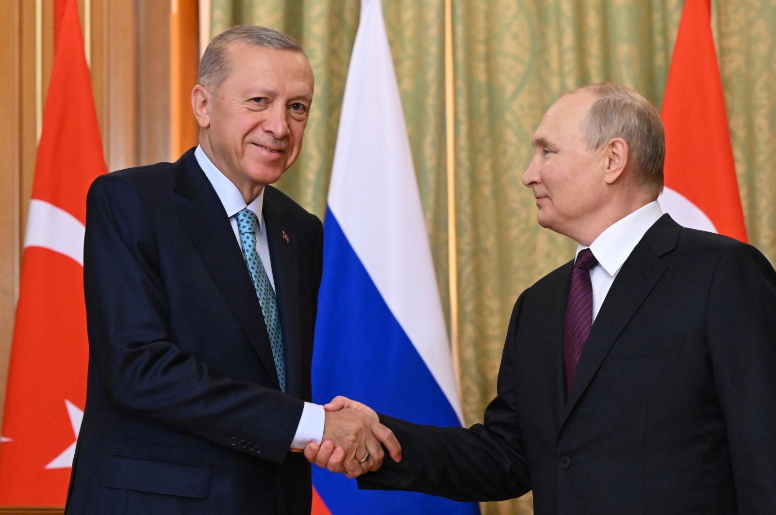 President Recep Tayyip Erdoğan and Russian President Vladimir Putin shake hands during their meeting in Sochi, Russia, Sept. 4, 2023. (EPA File Photo)