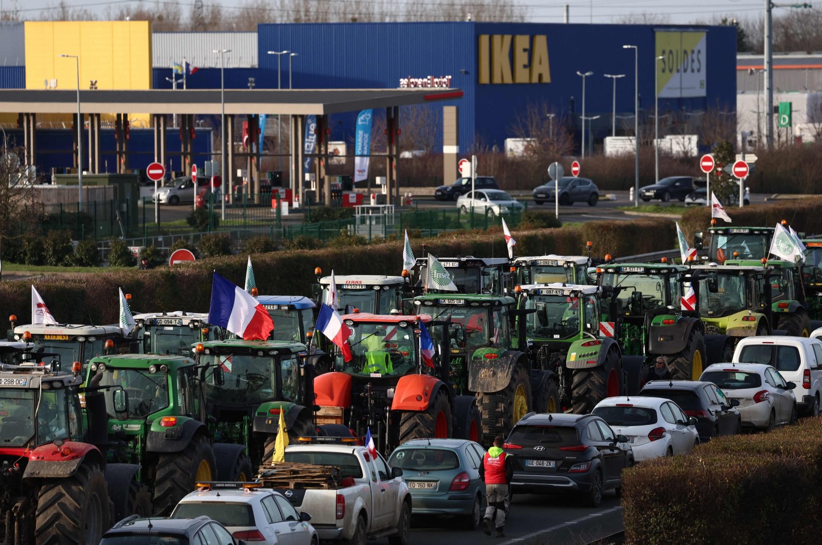 Farmers driving tractors take part in a road blockage of the A6 highway near Villabe, south of Paris, Jan. 29, 2024. (AFP Photo)