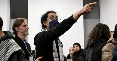 A young man gestures during a ceremony to commemorate the 2017 mosque shooting, in Quebec City, Canada, Jan. 29, 2024. (AP Photo)