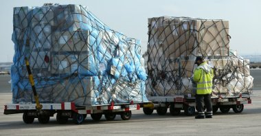 An employee checks freight at a ramp of Frankfurt airport, Germany, Nov. 27, 2020. (Reuters Photo)