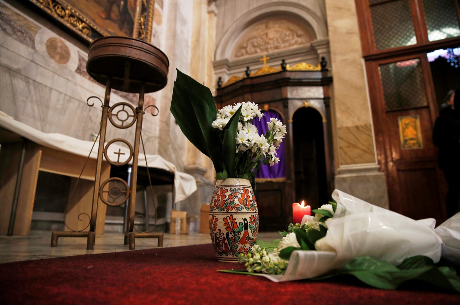 Flowers are placed inside the Italian Santa Maria Catholic Church a day after an attack during the Sunday service, in which one person was killed, Istanbul, Türkiye, Jan. 9, 2024. (Reuters Photo)