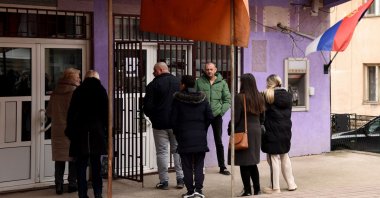 People wait in line to enter a bank in Leposavic, northern Kosovo, Jan. 29, 2024. (AFP Photo)