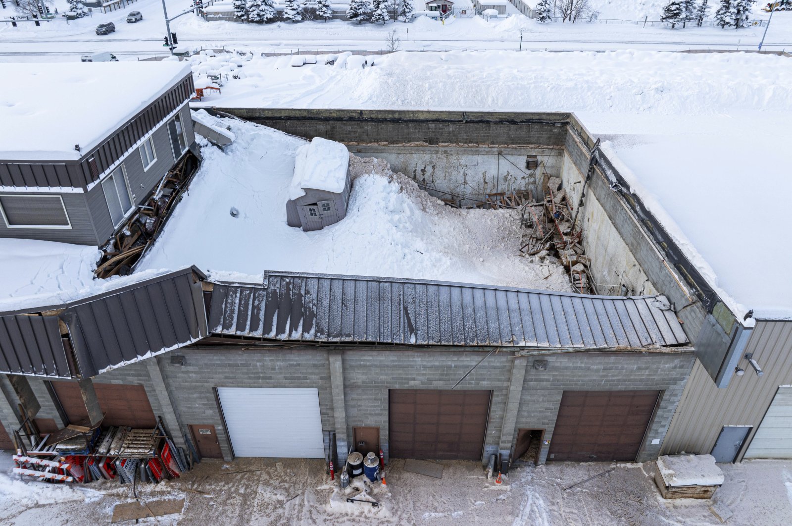 The roof of a building is partially collapsed by snow in Anchorage, Alaska, U.S., Jan. 30, 2024 (AP Photos)