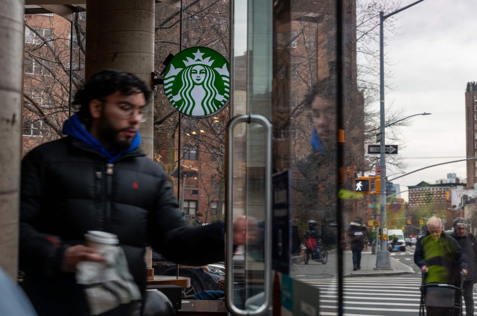 People exit a Starbucks store in Manhattan, New York City, U.S., Jan. 30, 2024. (AFP Photo)