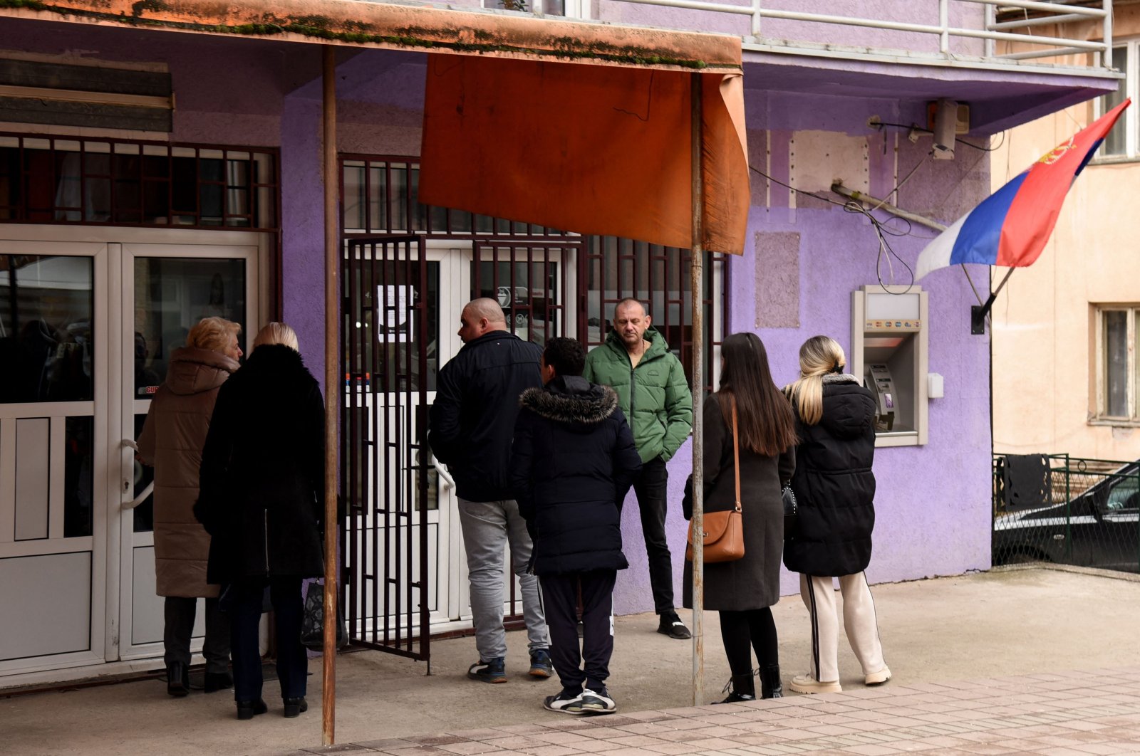 People wait in line to enter a bank in Leposavic, northern Kosovo, Jan. 29, 2024. (AFP Photo)