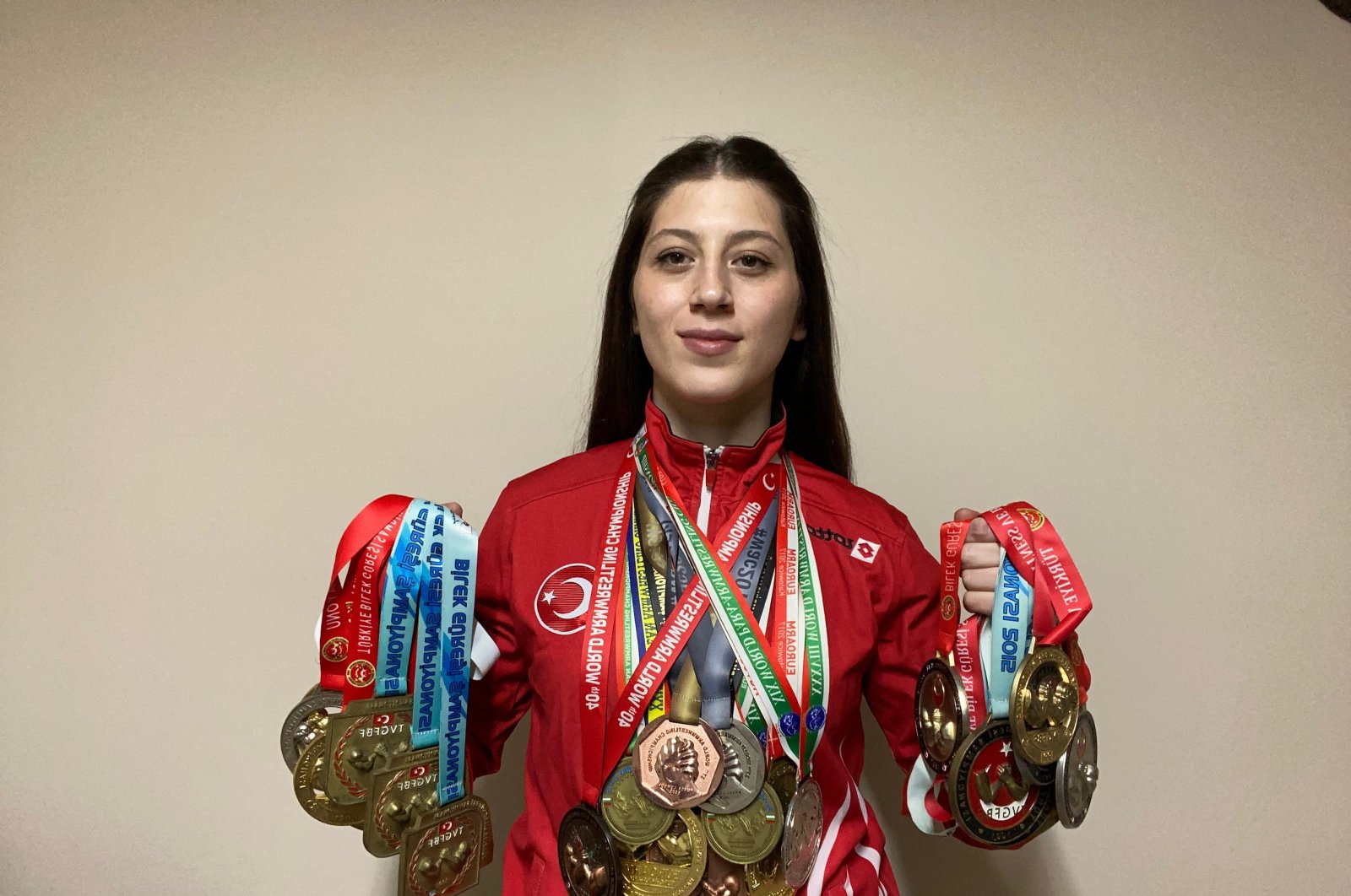 Turkish arm wrestler Sultan Sivrihisarlı poses for a photo with her medals, Afyon, Türkiye, Jan. 31, 2024. (AA Photo)