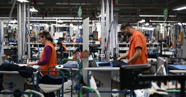 The workers are seen in a factory established in Edirne, which produces 65% of the electricity it consumes from a solar power plant, in northwestern Türkiye, Jan. 10, 2024. (AA Photo)