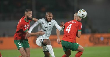 Morocco's Noussair Mazraoui (L) and South Africa's Thapelo James Morena (C) battle for the ball during the AFCON round of 16 match at Stade Laurent Pokou, San-Pedro, Ivory Coast, Jan. 30, 2024. (Getty Images Photo)