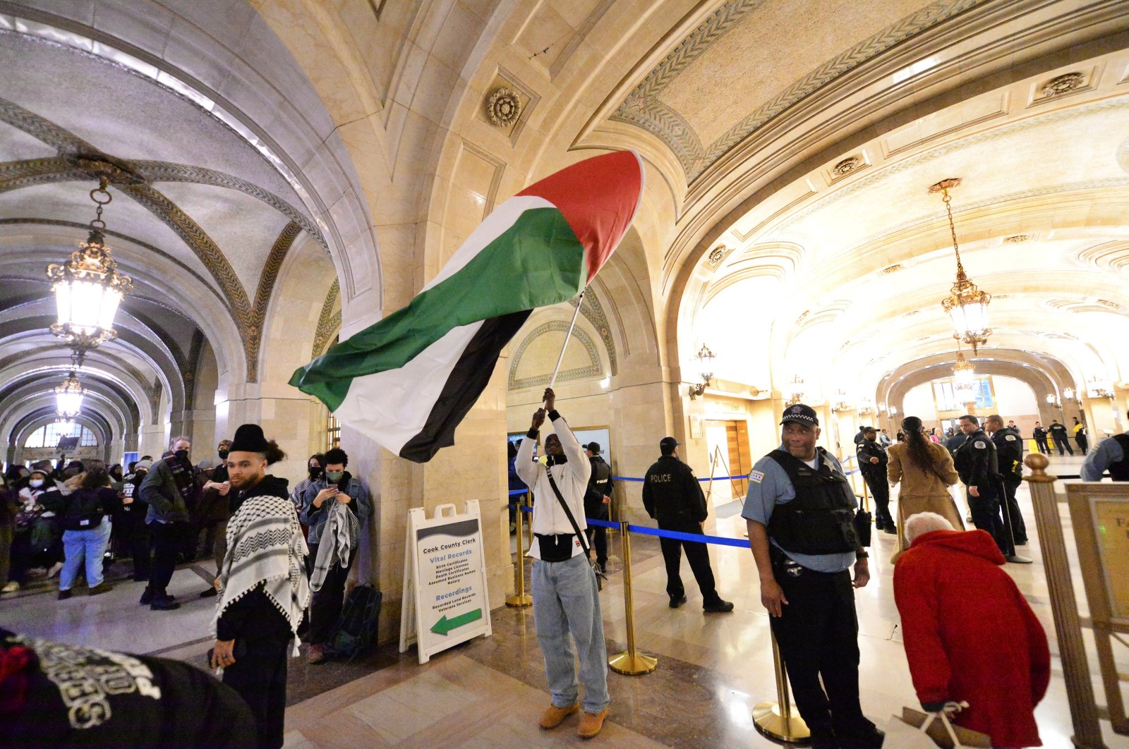 Pro-Palestine demonstrators rally in the lobby of City Hall as the City Council debated a symbolic resolution calling for a cease-fire in Gaza, Chicago, Illinois, U.S., Jan. 31, 2024. (AA Photo)